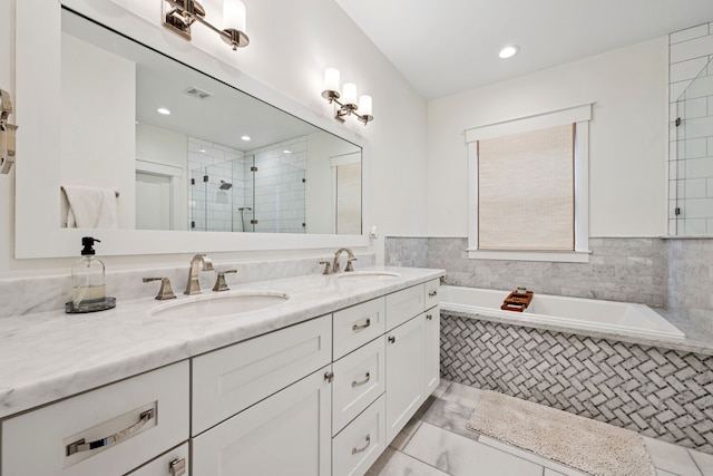 728 Allston St, Houston, TX 77007 - full bath with double vanity, a bath, a tile shower, and recessed lighting