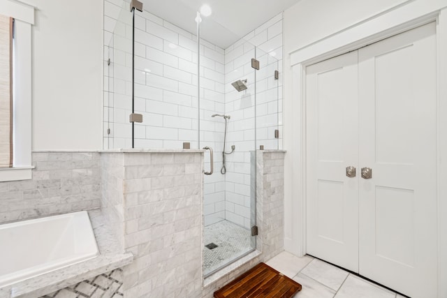 728 Allston St, Houston, TX 77007 - full bathroom featuring a stall shower, a garden tub, and tile patterned flooring