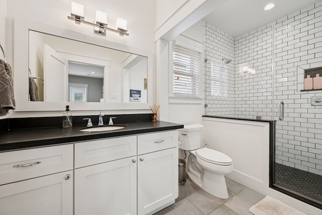728 Allston St, Houston, TX 77007 - full bath featuring vanity, a shower stall, tile patterned floors, and toilet