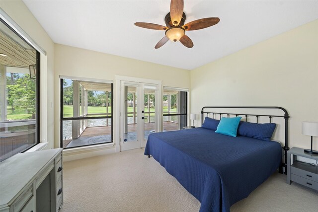 12986 Wood Harbour Dr, Montgomery, TX 77356 - bedroom with light carpet, access to exterior, multiple windows, and ceiling fan