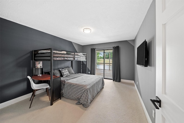 12986 Wood Harbour Dr, Montgomery, TX 77356 - bedroom featuring carpet flooring, baseboards, and a textured ceiling