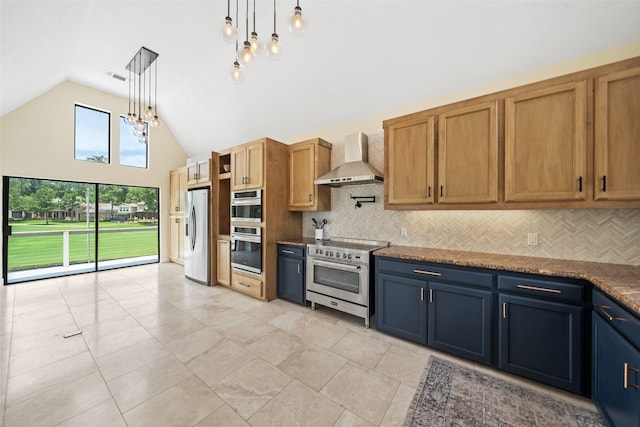 12986 Wood Harbour Dr, Montgomery, TX 77356 - kitchen with wall chimney range hood, appliances with stainless steel finishes, vaulted ceiling, decorative backsplash, and decorative light fixtures