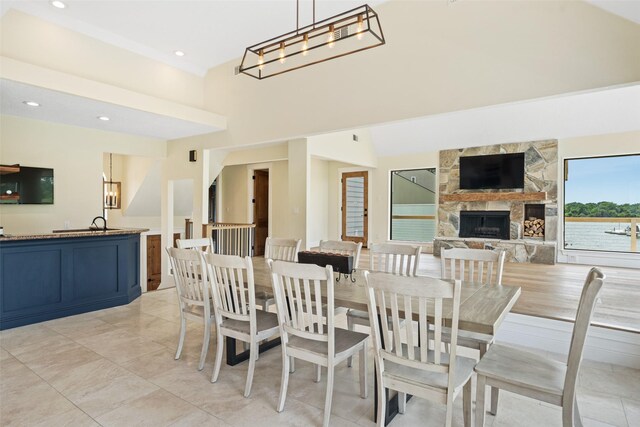 12986 Wood Harbour Dr, Montgomery, TX 77356 - dining space with a stone fireplace and recessed lighting