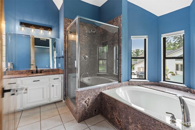 12986 Wood Harbour Dr, Montgomery, TX 77356 - bathroom with a garden tub, vanity, a shower stall, and tile patterned flooring