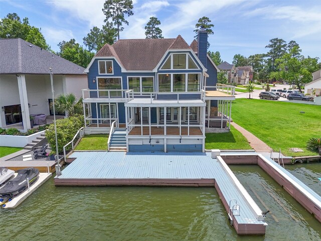 12986 Wood Harbour Dr, Montgomery, TX 77356 - rear view of house with a balcony, a water view, stairs, a chimney, and a yard