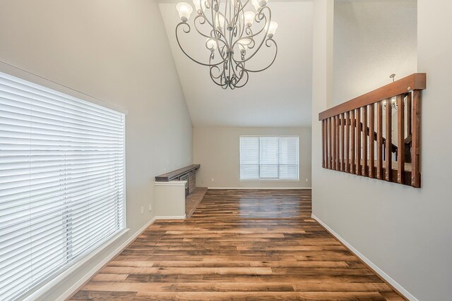 19523 Enchanted Grove Dr, Spring, TX 77388 - interior space featuring a chandelier, high vaulted ceiling, wood finished floors, and baseboards