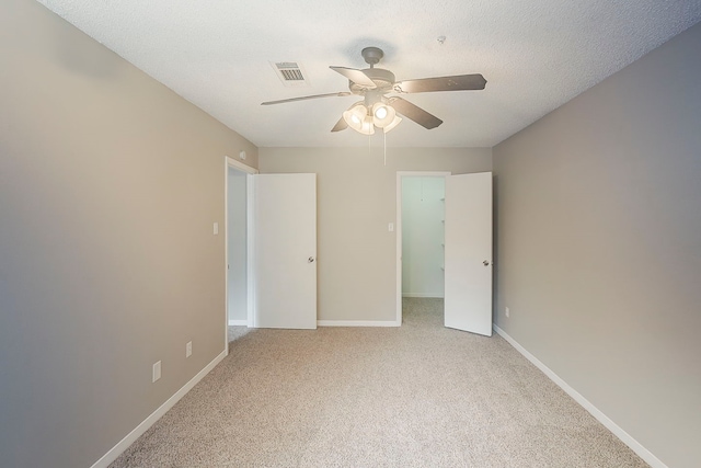 19523 Enchanted Grove Dr, Spring, TX 77388 - unfurnished bedroom featuring light carpet, baseboards, and a ceiling fan