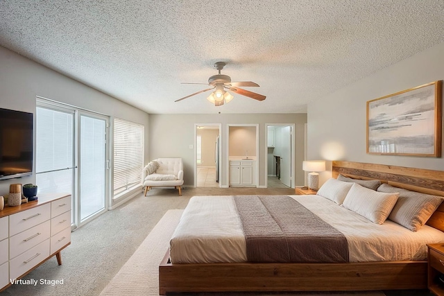 19523 Enchanted Grove Dr, Spring, TX 77388 - bedroom with access to outside, light carpet, a textured ceiling, ensuite bath, and a ceiling fan