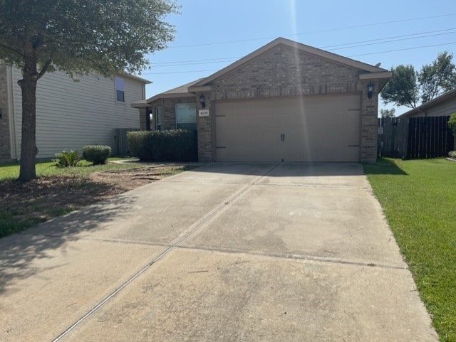 16239 Silver Wing Ln, Hockley, TX 77447 - garage with concrete driveway
