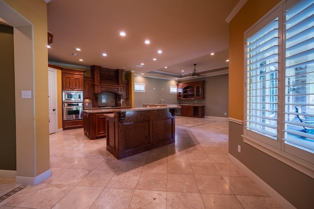 17715 Badtke Rd, Hockley, TX 77447 - kitchen featuring appliances with stainless steel finishes, a spacious island, ornamental molding, recessed lighting, and ceiling fan