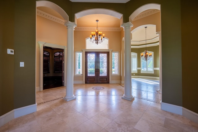 17715 Badtke Rd, Hockley, TX 77447 - foyer entrance featuring a chandelier, french doors, baseboards, ornate columns, and a towering ceiling