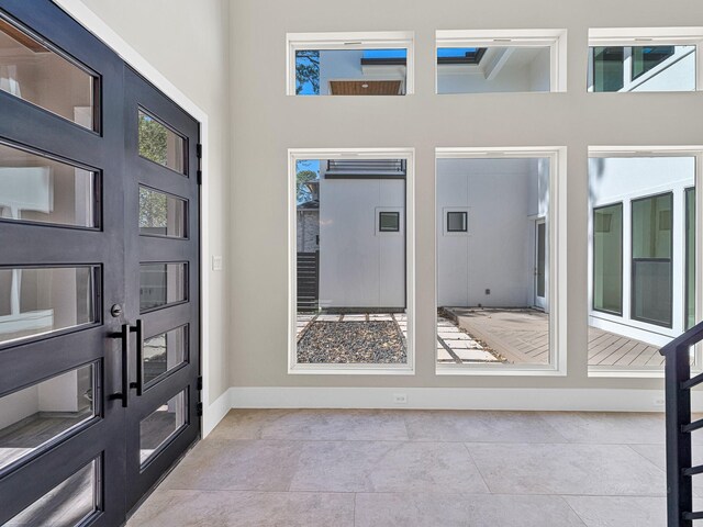 12914 Figaro Dr, Houston, TX 77024 - entrance foyer featuring baseboards and a high ceiling