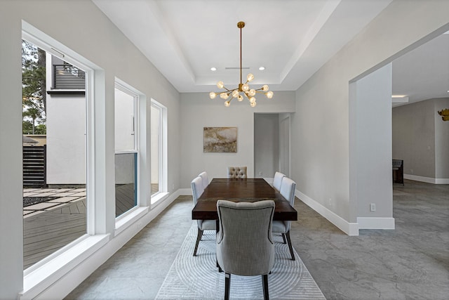 12914 Figaro Dr, Houston, TX 77024 - dining room with a chandelier, recessed lighting, baseboards, and a tray ceiling