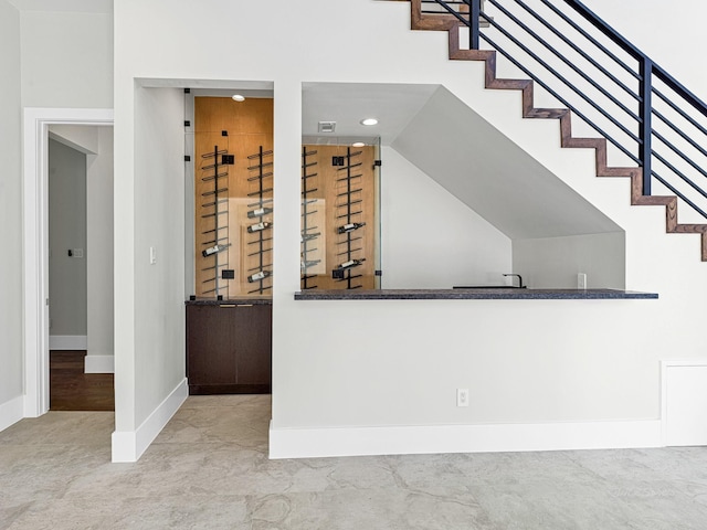 12914 Figaro Dr, Houston, TX 77024 - wine cellar featuring baseboards, recessed lighting, and wet bar