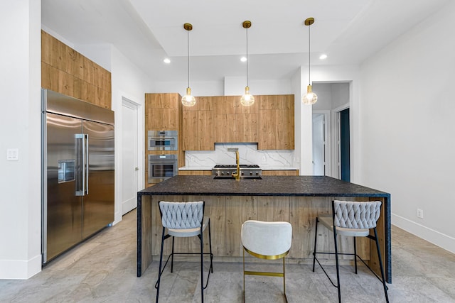 12914 Figaro Dr, Houston, TX 77024 - kitchen featuring appliances with stainless steel finishes, a sink, a kitchen breakfast bar, modern cabinets, and recessed lighting
