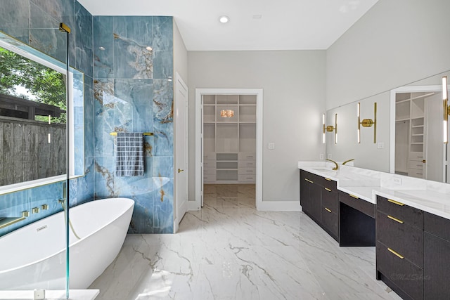 12914 Figaro Dr, Houston, TX 77024 - full bath with a soaking tub, a spacious closet, double vanity, and marble finish floors