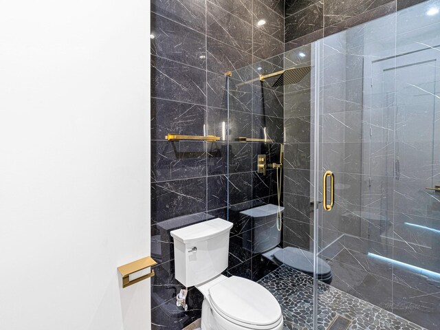 12914 Figaro Dr, Houston, TX 77024 - bathroom with toilet and a shower stall