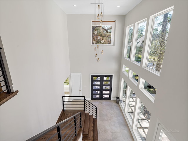 12914 Figaro Dr, Houston, TX 77024 - foyer featuring a towering ceiling and french doors