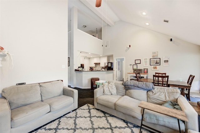 18226 Golden Falls Ln, Spring, TX 77379 - living room with baseboards, high vaulted ceiling, ceiling fan, and beamed ceiling
