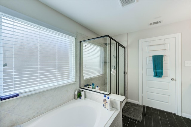 18226 Golden Falls Ln, Spring, TX 77379 - full bath featuring a bath, a stall shower, and baseboards