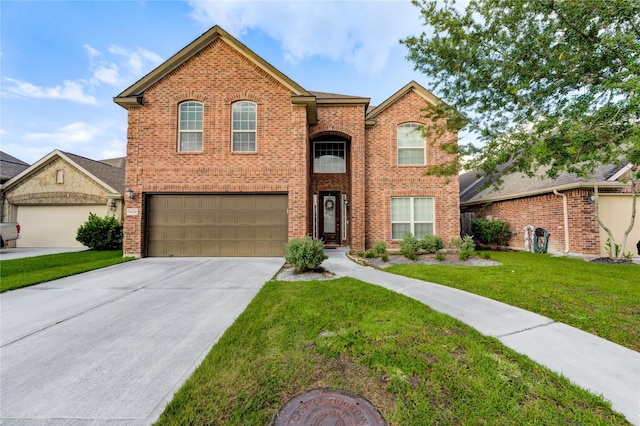 18226 Golden Falls Ln, Spring, TX 77379 - traditional-style house featuring brick siding, driveway, a front yard, and an attached garage