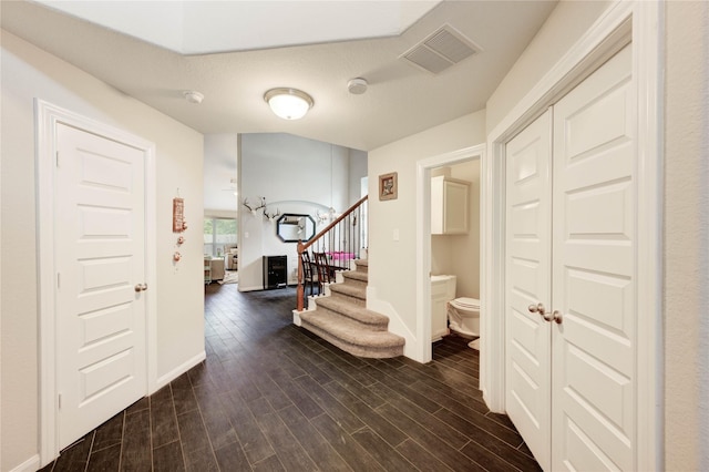 18226 Golden Falls Ln, Spring, TX 77379 - foyer featuring dark wood-style floors, stairway, and baseboards