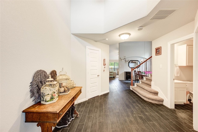 18226 Golden Falls Ln, Spring, TX 77379 - entryway with dark wood-style floors, stairs, and baseboards