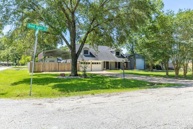 842 Broad Ripple Dr, Houston, TX 77336 - view of front of home featuring a detached carport, driveway, and a garage