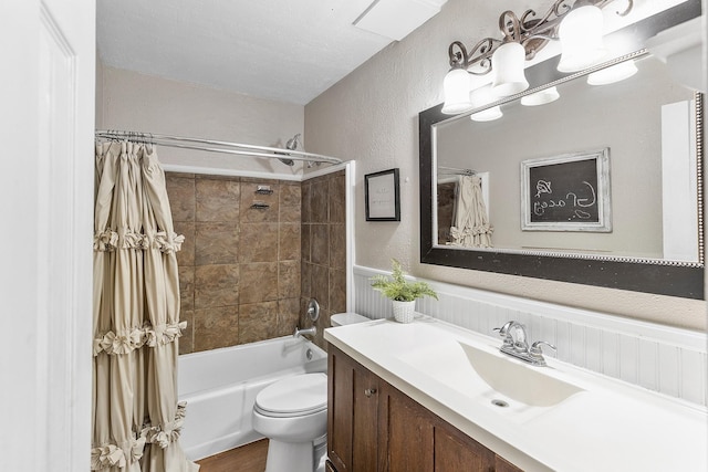 842 Broad Ripple Dr, Houston, TX 77336 - full bathroom featuring a textured wall, vanity, shower / bath combo, wainscoting, and toilet