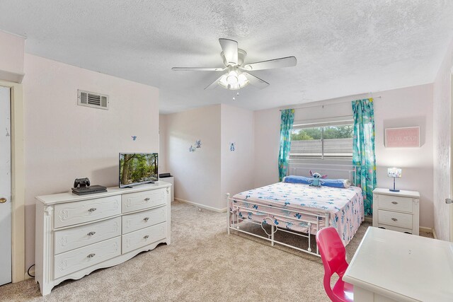 842 Broad Ripple Dr, Houston, TX 77336 - bedroom with light carpet, a textured ceiling, ceiling fan, and baseboards