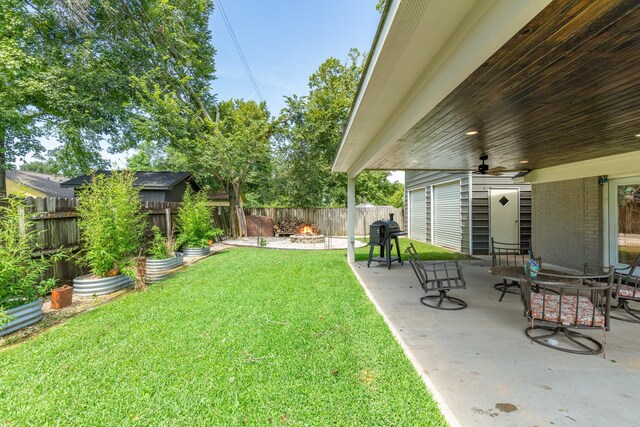 842 Broad Ripple Dr, Houston, TX 77336 - view of yard featuring a ceiling fan, a patio, and an outdoor fire pit