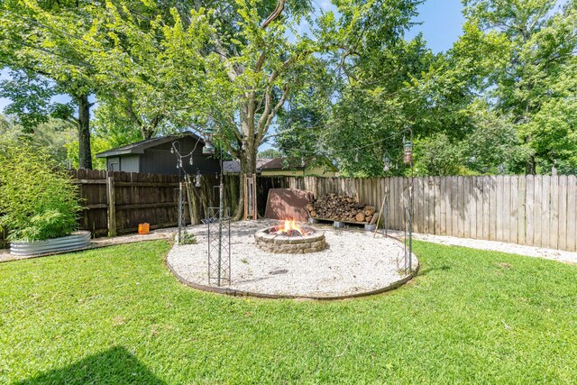 842 Broad Ripple Dr, Houston, TX 77336 - view of yard with an outdoor fire pit