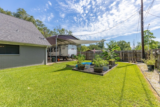 842 Broad Ripple Dr, Houston, TX 77336 - view of yard featuring a vegetable garden and a carport