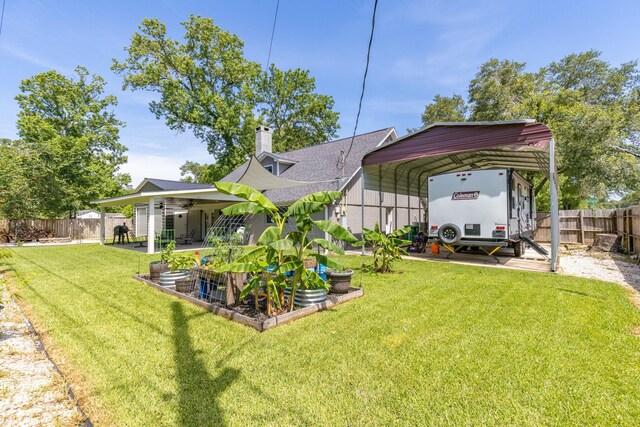 842 Broad Ripple Dr, Houston, TX 77336 - view of yard featuring a carport and a garden