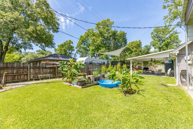 842 Broad Ripple Dr, Houston, TX 77336 - view of yard with a vegetable garden and a patio