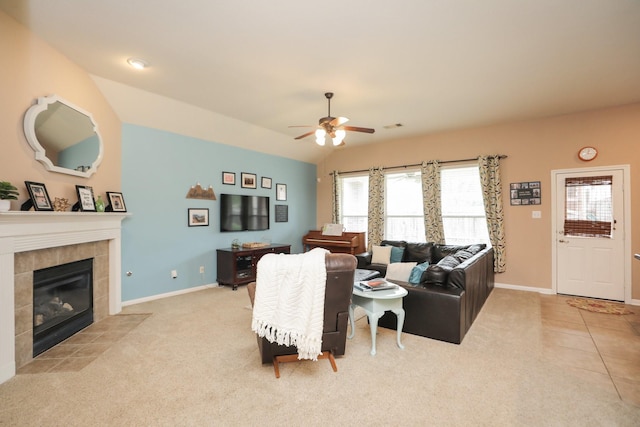 18123 Quarry Vale Dr, Cypress, TX 77429 - living area with ceiling fan, carpet, baseboards, a tile fireplace, and vaulted ceiling