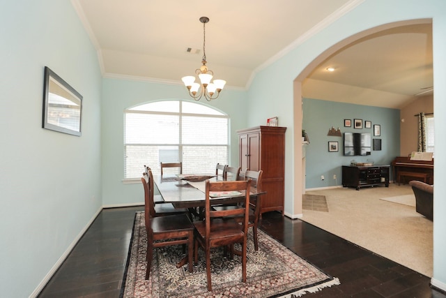 18123 Quarry Vale Dr, Cypress, TX 77429 - dining room with a chandelier, baseboards, ornamental molding, dark wood-style floors, and arched walkways