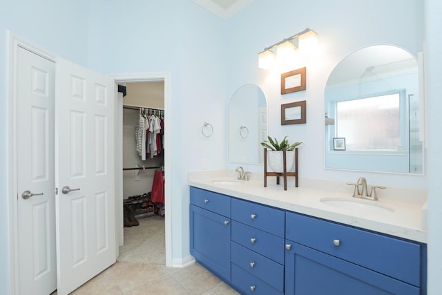 18123 Quarry Vale Dr, Cypress, TX 77429 - bathroom featuring tile patterned flooring, double vanity, and a walk in closet