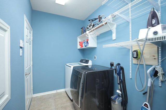 18123 Quarry Vale Dr, Cypress, TX 77429 - laundry room featuring washer and clothes dryer, baseboards, and light tile patterned floors