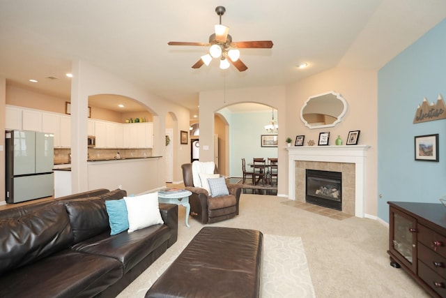18123 Quarry Vale Dr, Cypress, TX 77429 - living area with a ceiling fan, light colored carpet, arched walkways, recessed lighting, and baseboards