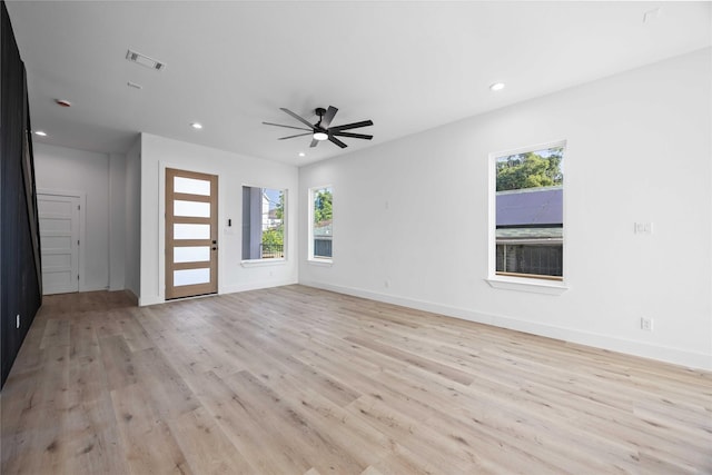 2206 Bleker St, Houston, TX 77026 - unfurnished living room with plenty of natural light, light wood-type flooring, recessed lighting, ceiling fan, and baseboards