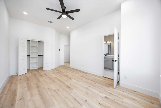 2206 Bleker St, Houston, TX 77026 - unfurnished bedroom with light wood-style flooring, a sink, baseboards, recessed lighting, and ensuite bath