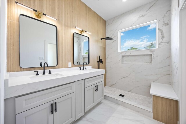 2206 Bleker St, Houston, TX 77026 - bathroom featuring marble finish flooring, double vanity, and a marble finish shower
