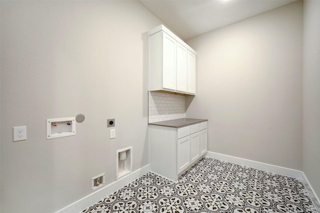 688 Lonestar Rd, Huntsville, TX 77340 - washroom featuring hookup for an electric dryer, cabinet space, baseboards, and hookup for a washing machine