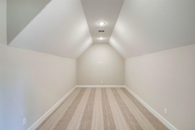 688 Lonestar Rd, Huntsville, TX 77340 - additional living space with vaulted ceiling, baseboards, light carpet, and recessed lighting