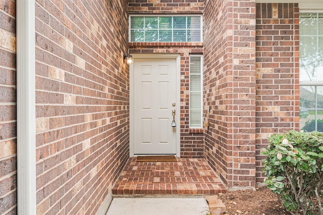 810 Dracena Ct, Richmond, TX 77406 - view of exterior entry featuring brick siding