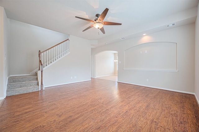 810 Dracena Ct, Richmond, TX 77406 - unfurnished living room with ceiling fan, stairs, wood finished floors, and baseboards