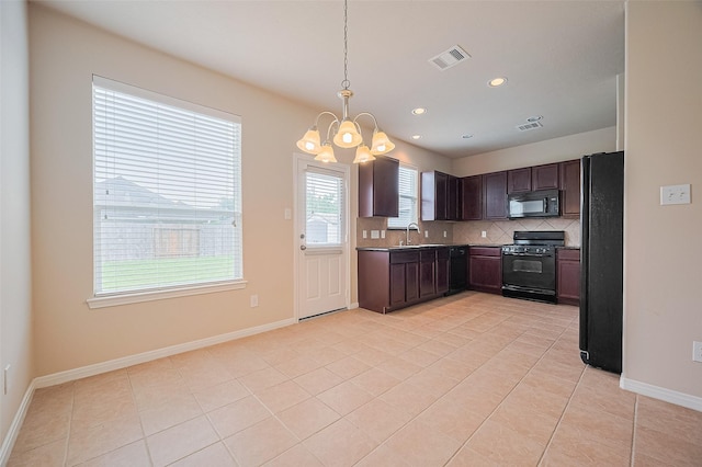 810 Dracena Ct, Richmond, TX 77406 - kitchen with black appliances, a chandelier, backsplash, light tile patterned floors, and recessed lighting