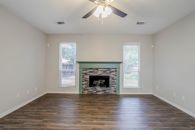 16511 Bluefin St, Crosby, TX 77532 - unfurnished living room featuring healthy amount of natural light, wood finished floors, baseboards, and a ceiling fan