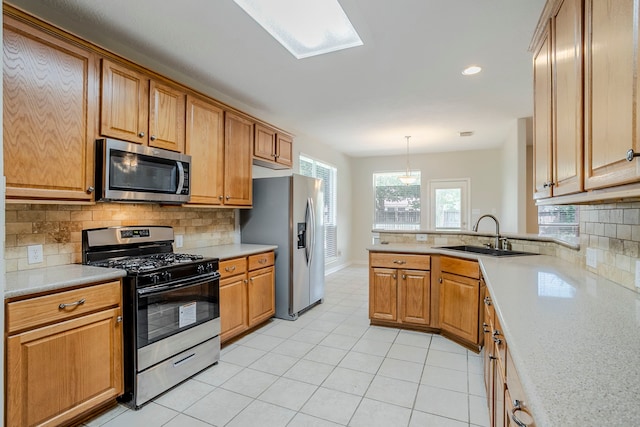 16511 Bluefin St, Crosby, TX 77532 - kitchen with appliances with stainless steel finishes, a sink, decorative backsplash, light countertops, and recessed lighting